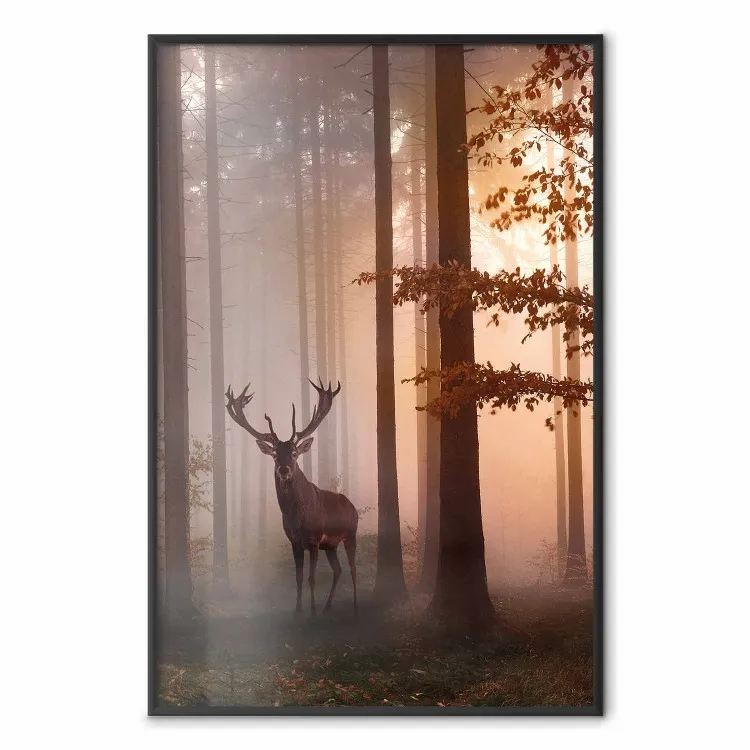 Morning - wild deer among forest trees against the backdrop of an autumn landscape