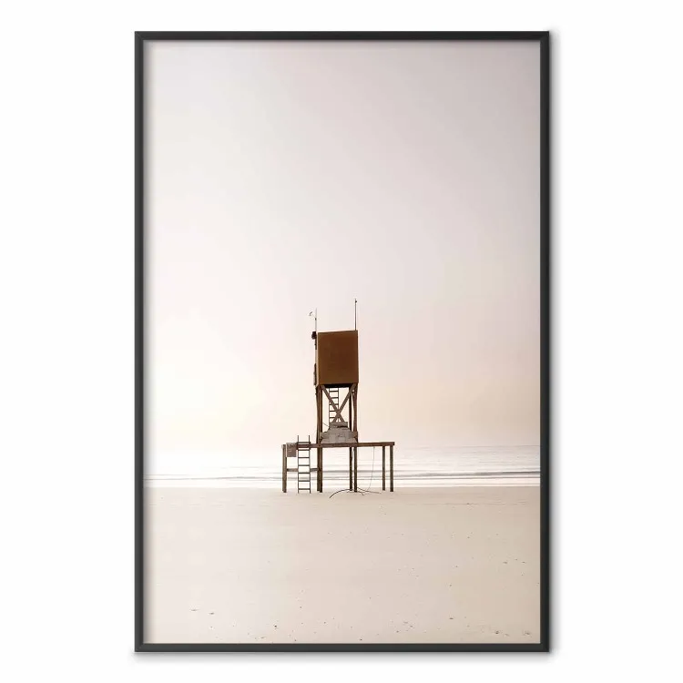 September Dawn - lifeguard tower on the beach in the light of bright sky