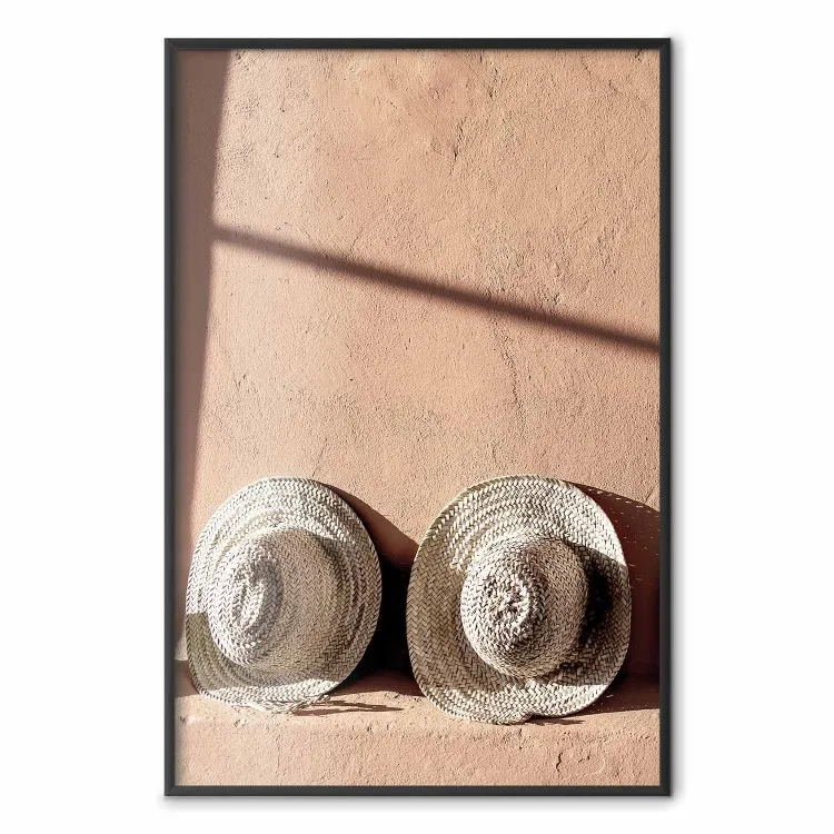 Sunlit Couple - two hats in the sunlight against a wall