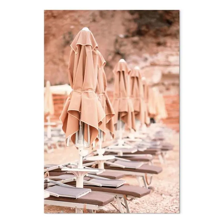 Seaside resort - Italian landscape with a stone beach and parasols