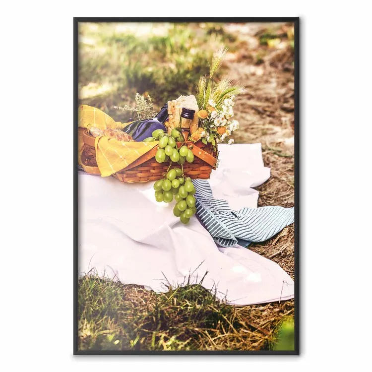 Picnic - composition with green fruits in a wicker basket against a natural background