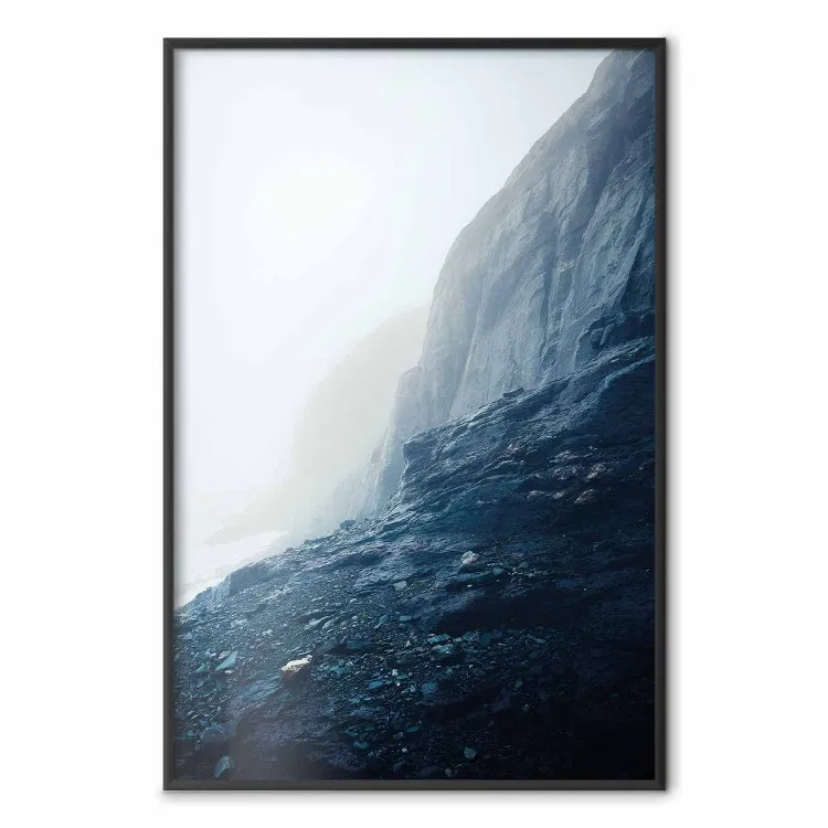 Misty Statue - landscape of rocky cliffs above water in thick fog