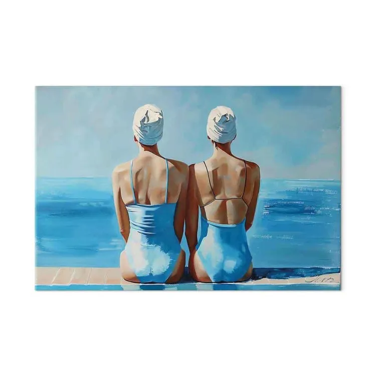 Blue harmony - two women in swimming costumes by the sea